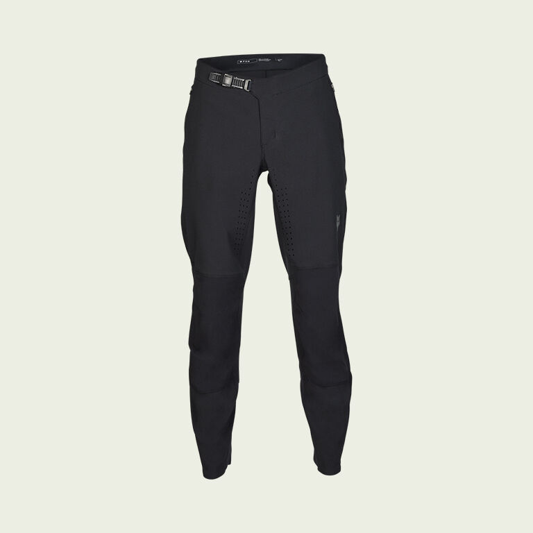 dark mtb pants on green background