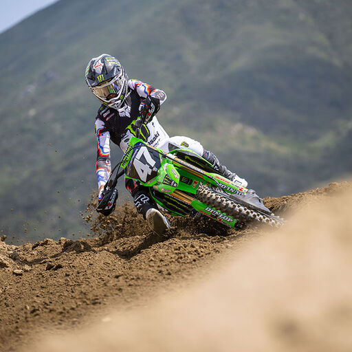 Kitchen riding a dirt bike wearing Scans kit