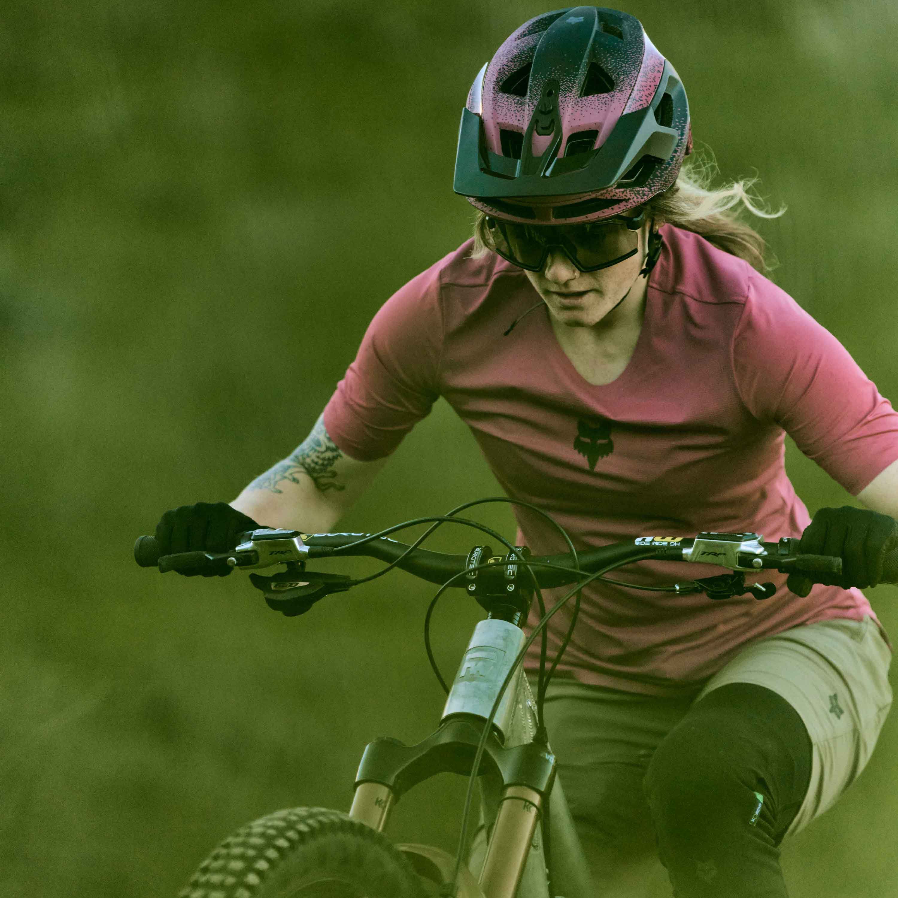woman in flexair gear riding a mountain bike