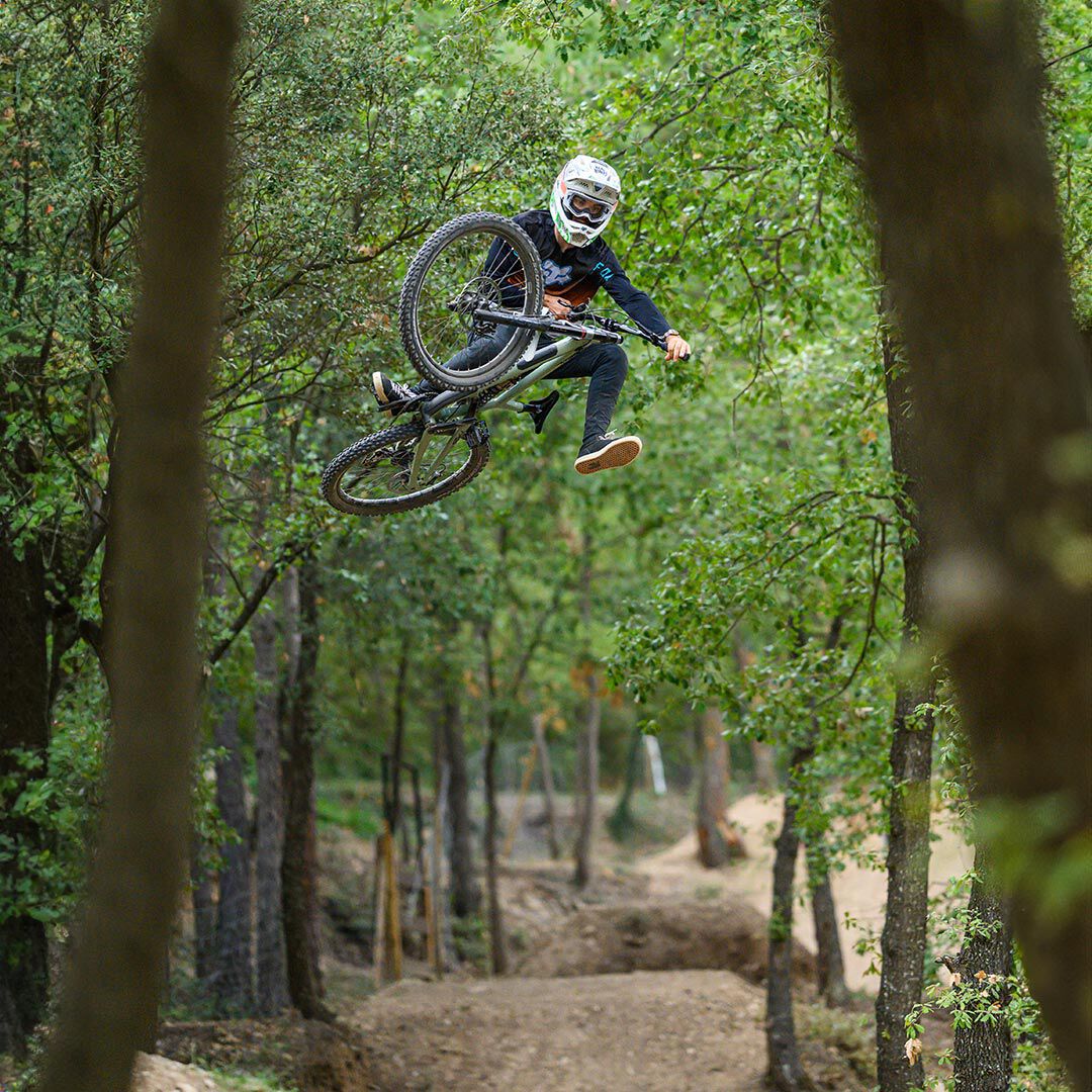 Wring out a cloth over a bucket.