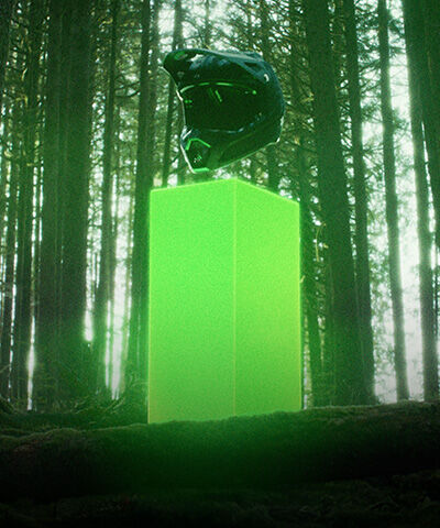 Speedframe bike helmet floating with vegetation in the back