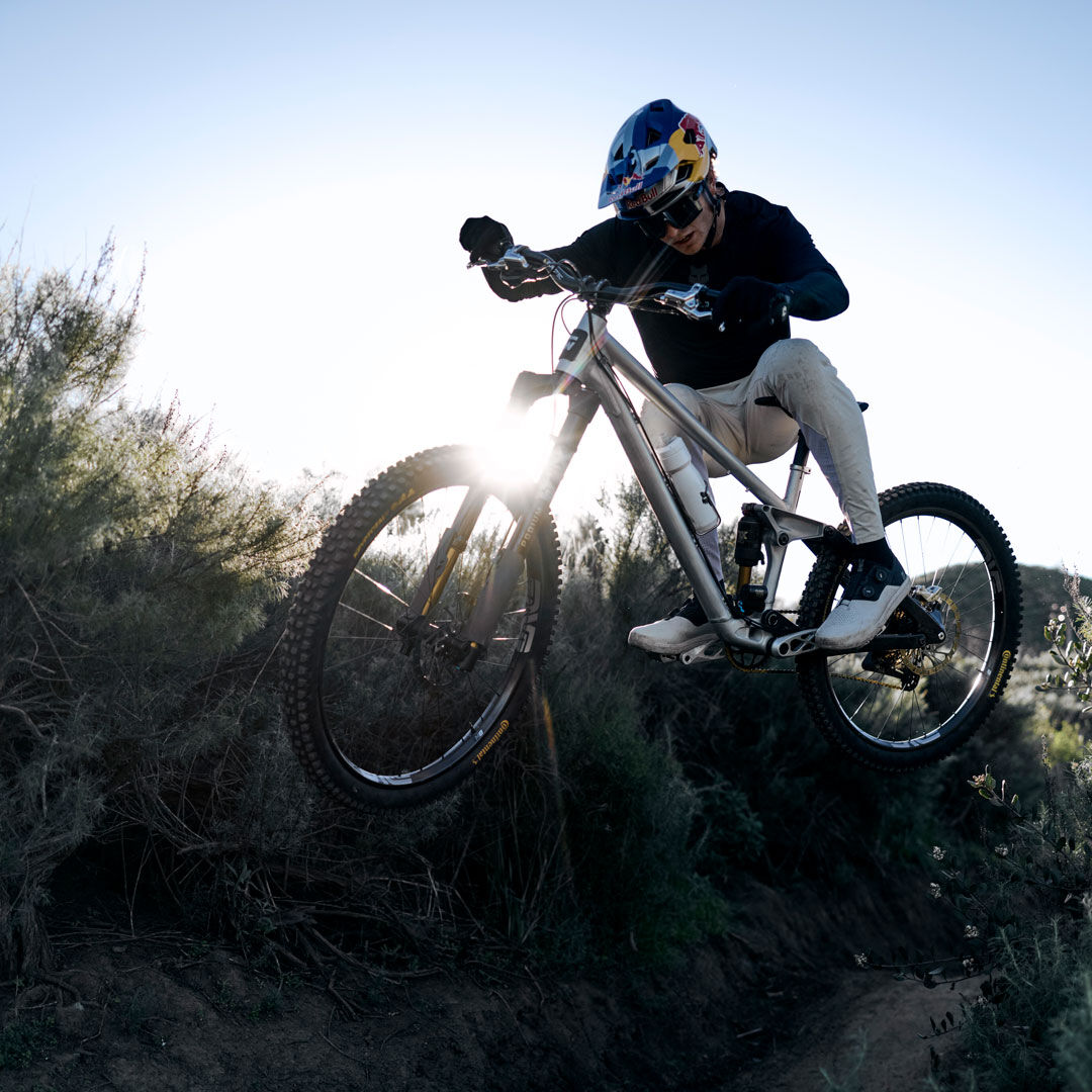 man in flexair gear riding a mountain bike